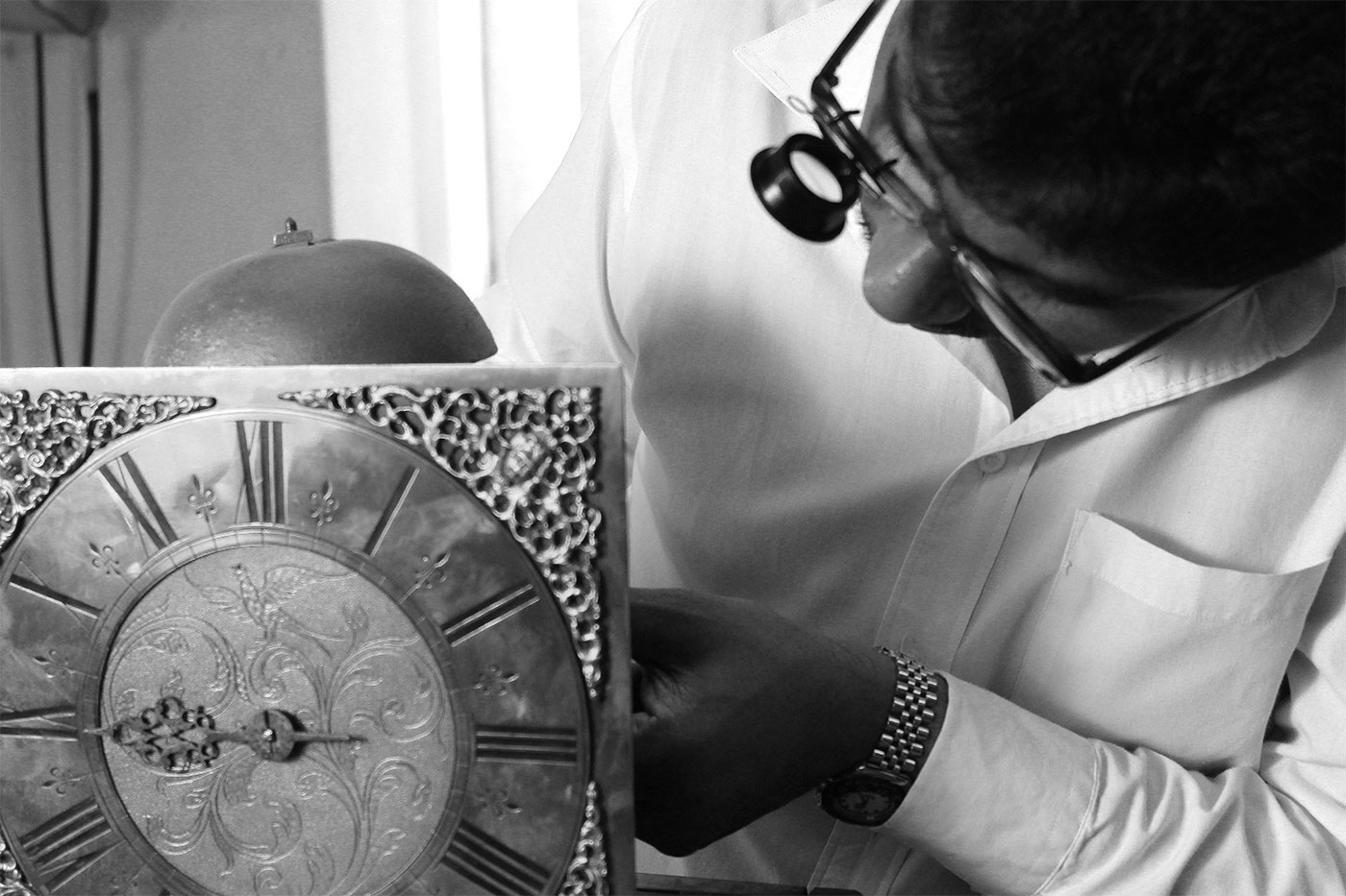 Devan Moodley working on clock